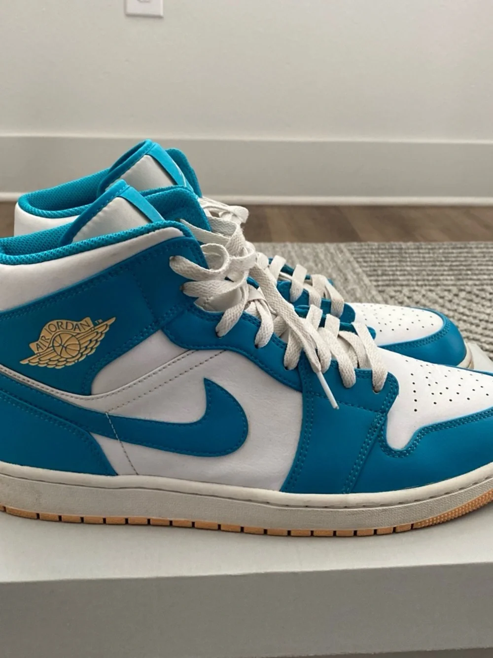 Jordan Air Jordan 1 Mid White and Teal Basketball Sneakers